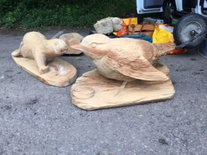 dipper and otter sculpture being loaded