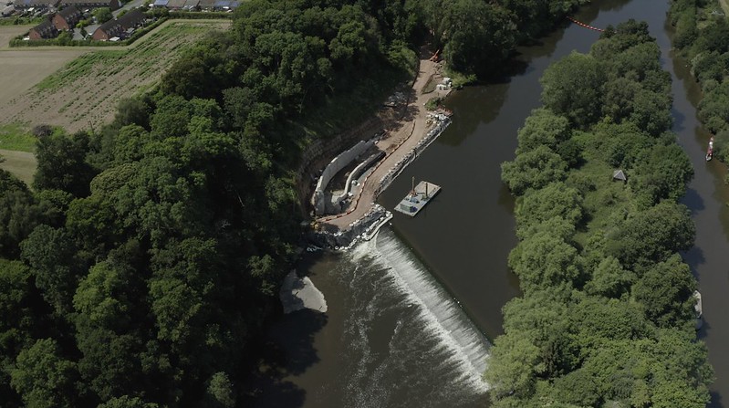 drone image of the Holt Weir with the fish pass in construction at the topmost (upstream) corner by Unlocking The Severn demonstrating how important location is to how does a fish pass works
