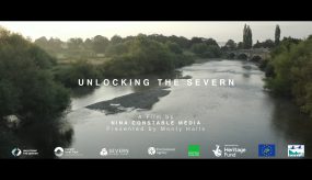 Still from Unlocking the Severn project documentary film by Nina Constable Media showing the River Severn in the upper reaches in Shropshire with gravel beds exposed